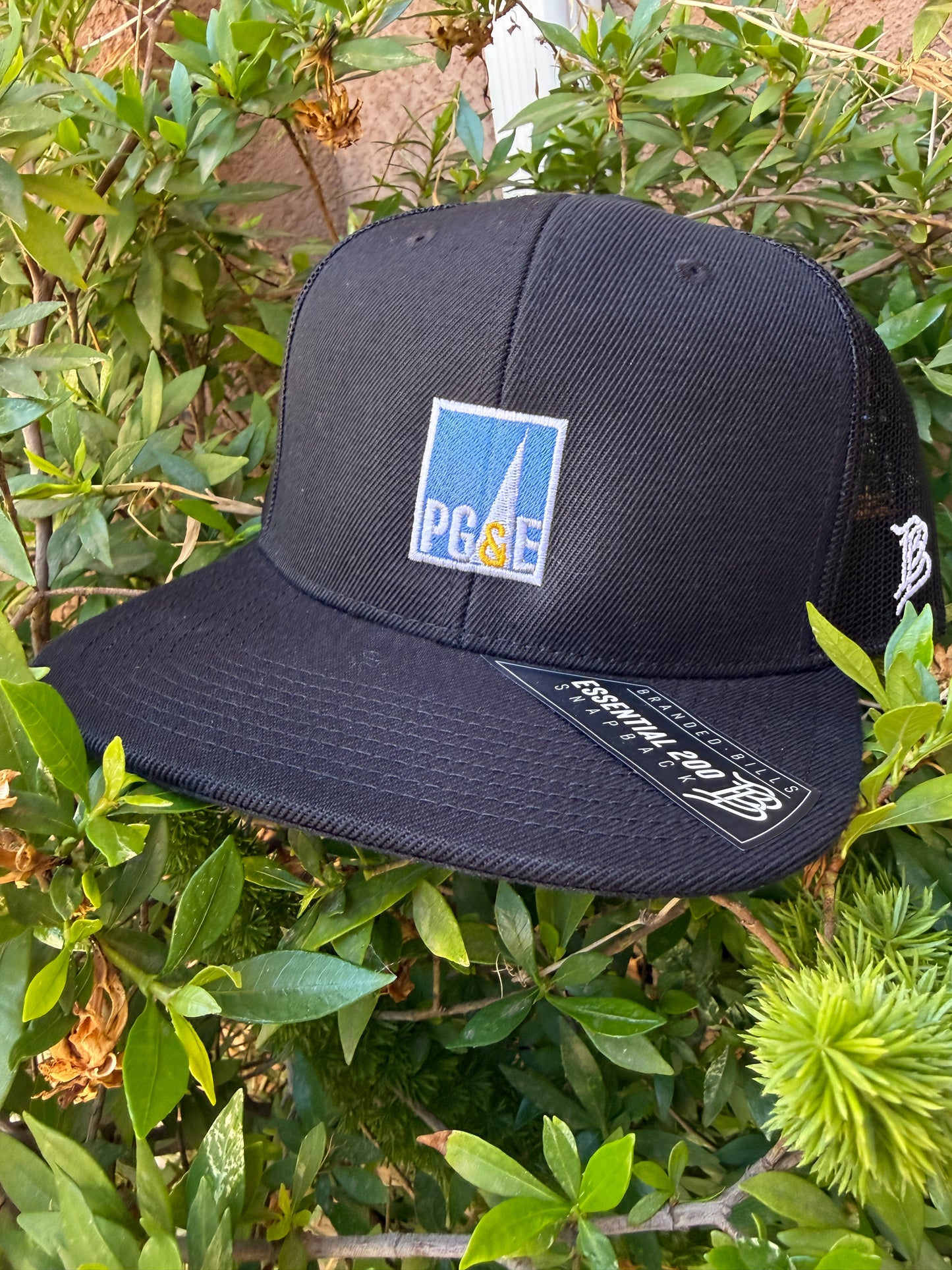 Branded Bill 200 Flat Bill Trucker PG&E Spotlight logo
